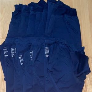 Multiple (5 each) navy scrub bottoms and tops.
